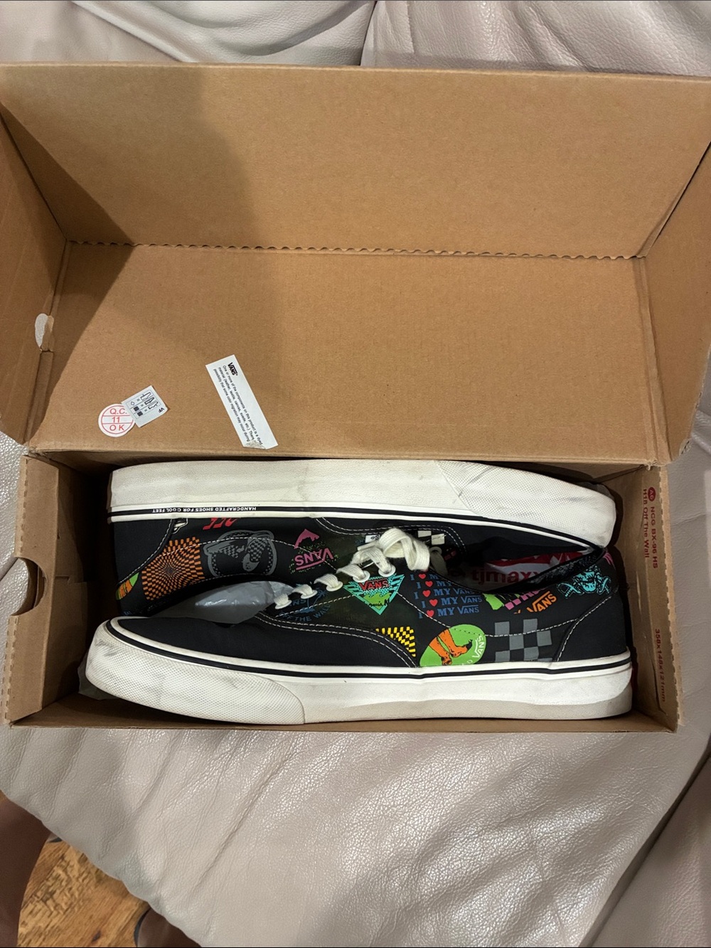 Vans Black Low-Top Sneakers with Multicolor Graphic Accents